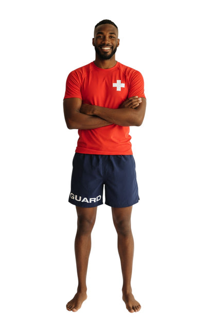 The Lifeguard Store Kiefer 4-Way Stretch Unisex Lifeguard Deck Short in navy blue, made of 100% polyester microfiber with "GUARD" printed on the leg.