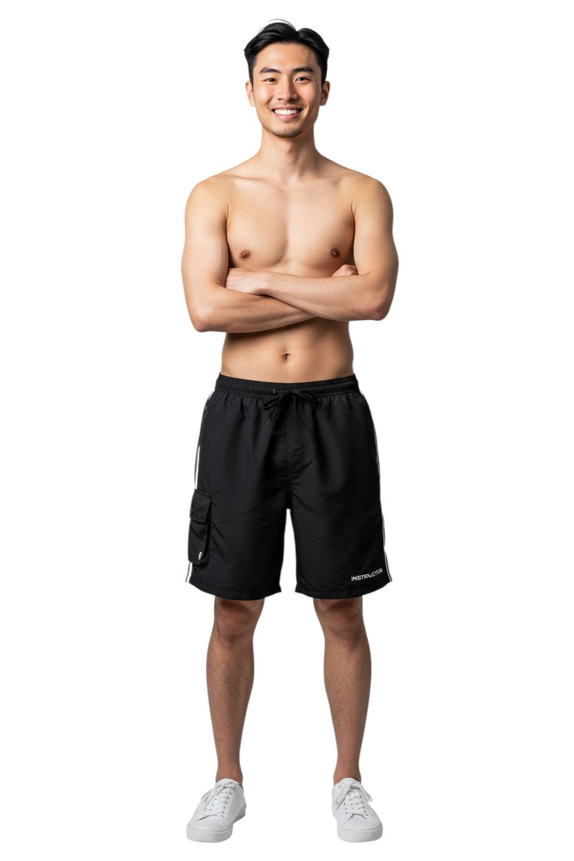 The Lifeguard Store Kiefer Instructor Board Shorts in black polyester with elastic waistband, drawstring, and cargo pocket.