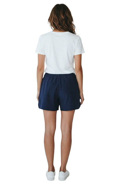 The Lifeguard Store Kiefer Instructor Women's navy blue polyester shorts with a 5" inseam and elastic waistband.