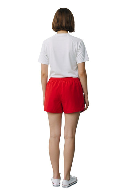 The Lifeguard Store Kiefer Manager Women's 5" red polyester shorts with elastic waistband and drawstring. Back view.