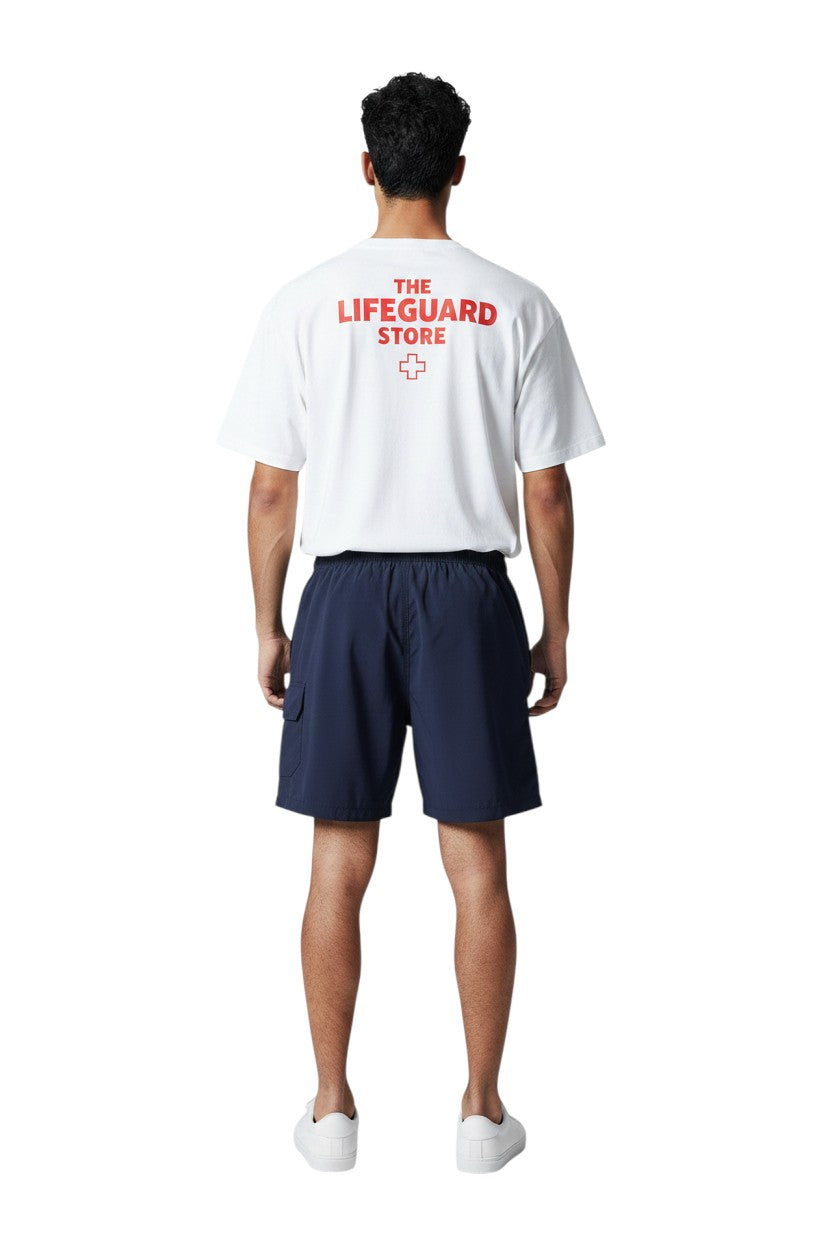 The Lifeguard Store Kiefer Men's navy blue board shorts with liner, elastic waistband, cargo pocket, and 7" inseam.