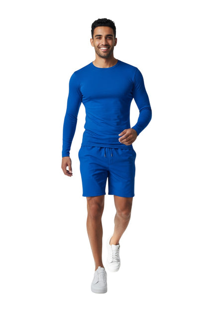 The Lifeguard Store Kiefer Solid Long Sleeve Crewneck Rashguard in royal blue, made of polyester and spandex blend with UPF50+ UV protection.