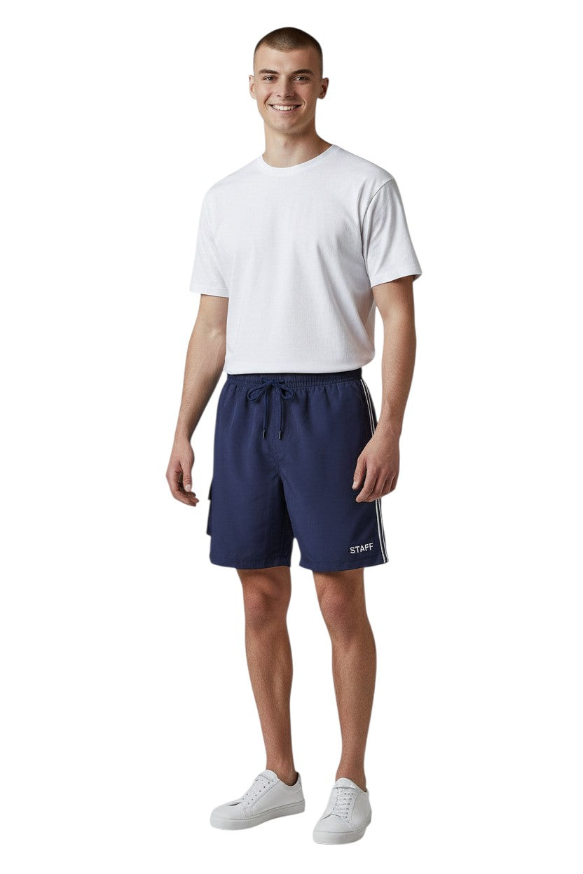 The Lifeguard Store Kiefer Staff Board Short with Liner in navy blue. Features white side stripes and "STAFF" text.
