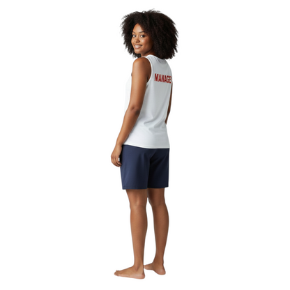 The Lifeguard Store white cotton Manager tank top with red lettering on the back worn by a woman in navy shorts