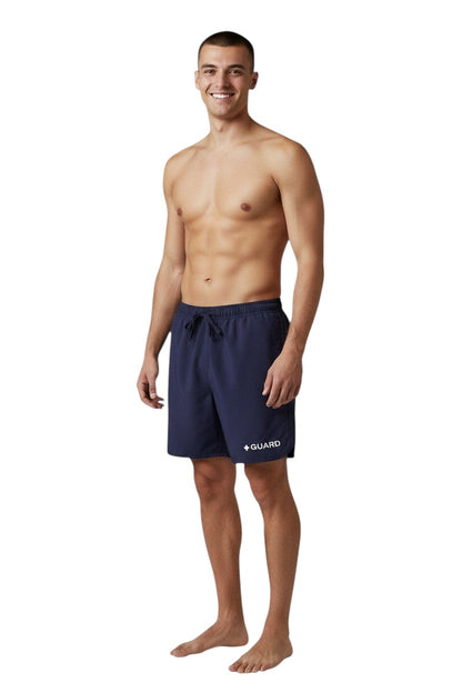 The Lifeguard Store Men's navy blue Guard 5" shorts with elastic waistband, drawstring, and side pockets. Quick-dry fabric.