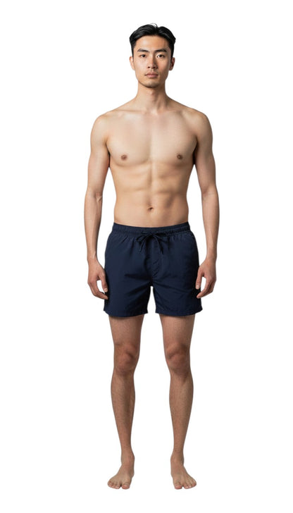 The Lifeguard Store navy blue polyester lifeguard shorts with liner, elastic waistband, drawstring, and red logo detail. 5" inseam.
