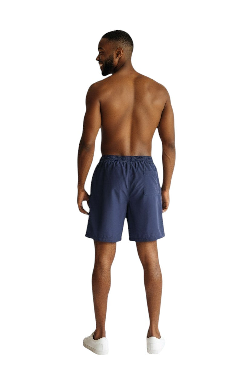 The Lifeguard Store navy blue polyester board shorts with elastic waistband and drawstring. Features UPF30+ protection.