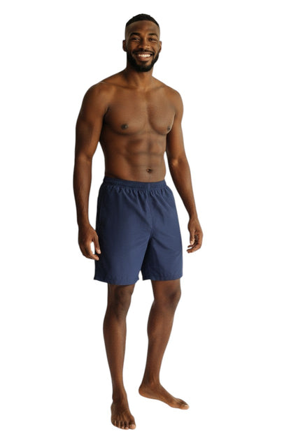 The Lifeguard Store navy blue polyester board shorts with elastic waistband and drawstring. Features quick-dry fabric and UPF30+ protection.