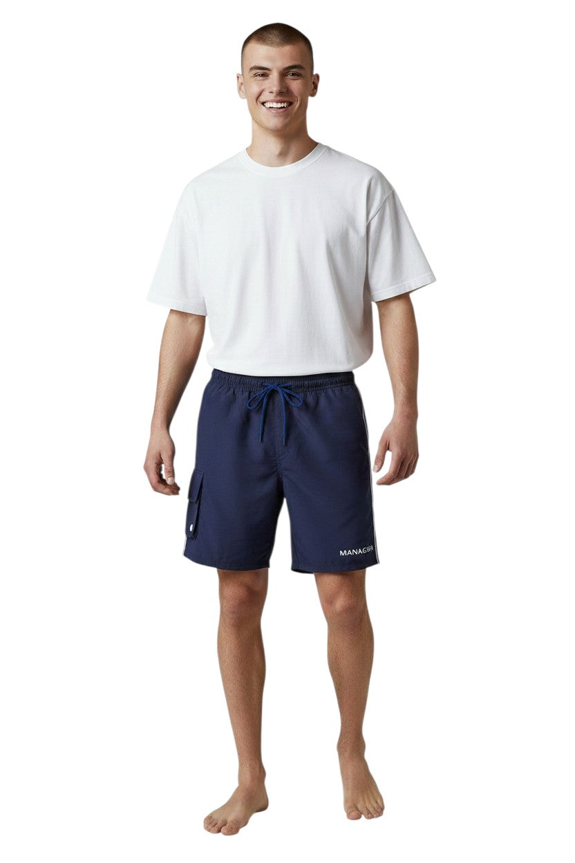 The Lifeguard Store navy blue polyester board shorts with white drawstring, cargo pocket, and side stripe detail.