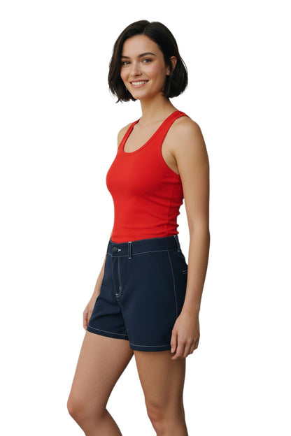 The Lifeguard Store RISE Solid Female Flex Short in navy blue polyester-spandex with white contrast stitching and a 5" inseam.