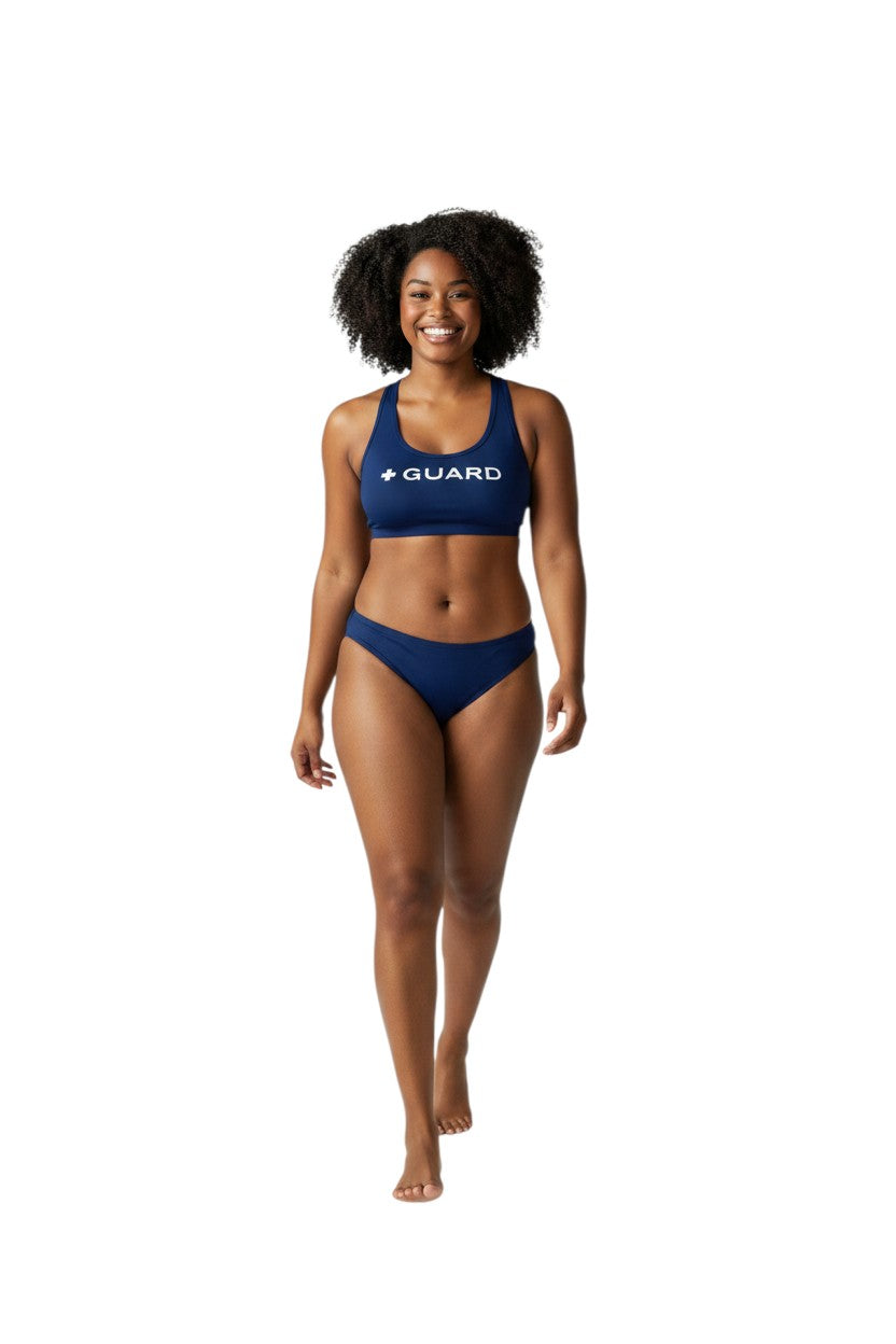 The Lifeguard Store navy blue racer back top with white + GUARD text. Made of poly stretch fabric.