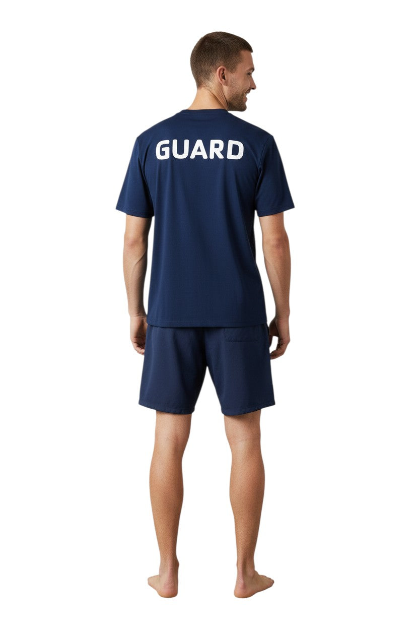 The Lifeguard Store navy blue short sleeve rashguard with GUARD printed on back. Made of polyester and spandex.