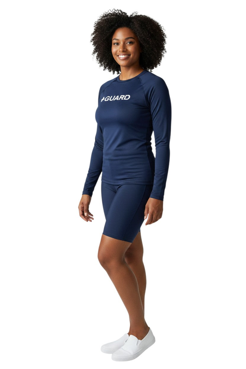 The Lifeguard Store navy blue long sleeve crewneck rashguard with white "+ GUARD" graphic. UPF 50+.