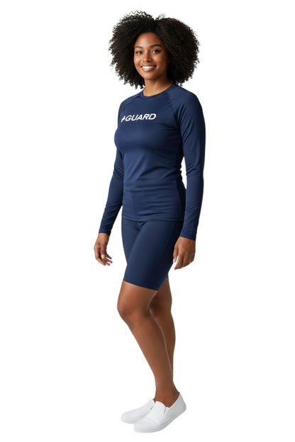 The Lifeguard Store navy blue long sleeve crewneck rashguard with white "+ GUARD" graphic. UPF 50+.