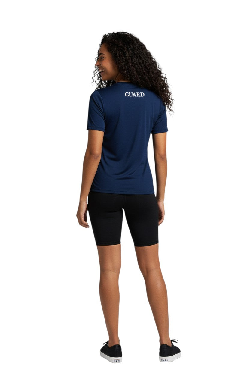 The Lifeguard Store navy blue short sleeve crew neck rashguard with GUARD text on back. Polyester/spandex blend.