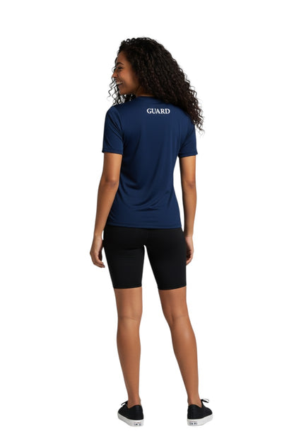 The Lifeguard Store navy blue short sleeve crew neck rashguard with GUARD text on back. Polyester/spandex blend.