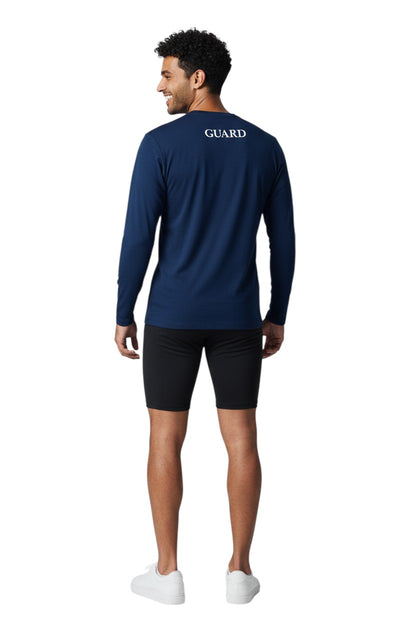The Lifeguard Store navy blue long sleeve crew neck rashguard with "GUARD" printed on the back. Made of poly-spandex fabric with UPF50+ protection.