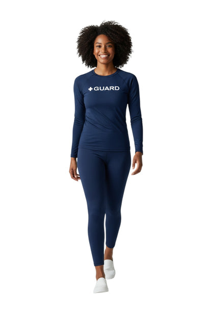The Lifeguard Store navy blue long sleeve rashguard with white "+ GUARD" graphic. UPF50+ protection.