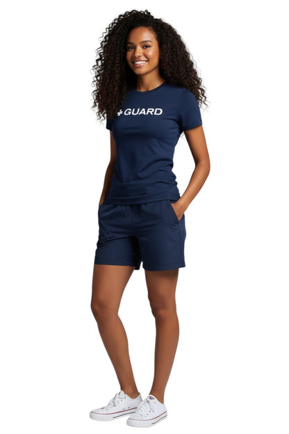 The Lifeguard Store Kiefer Guard short sleeve crewneck rashguard in navy blue polyester with white "+ GUARD" graphic. UPF50+ protection.