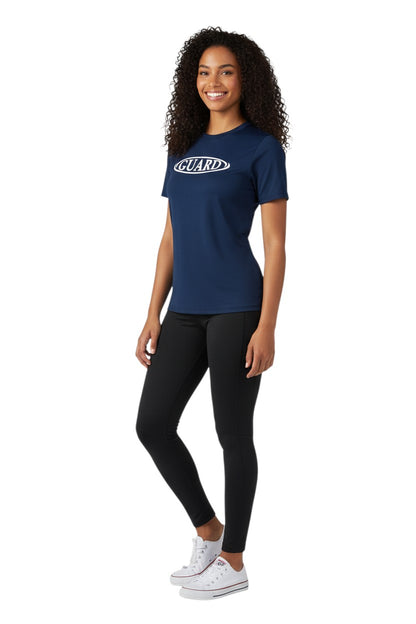The Lifeguard Store navy blue short sleeve crew neck rashguard with white GUARD logo on chest. Polyester-spandex blend.