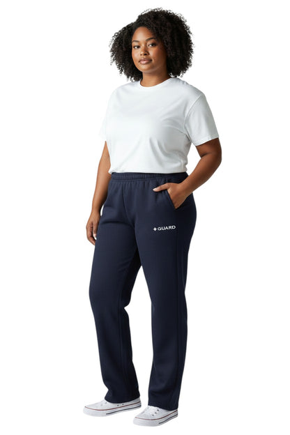 The Lifeguard Store navy blue sweatpants with drawstring and side pockets, featuring a white + GUARD logo.