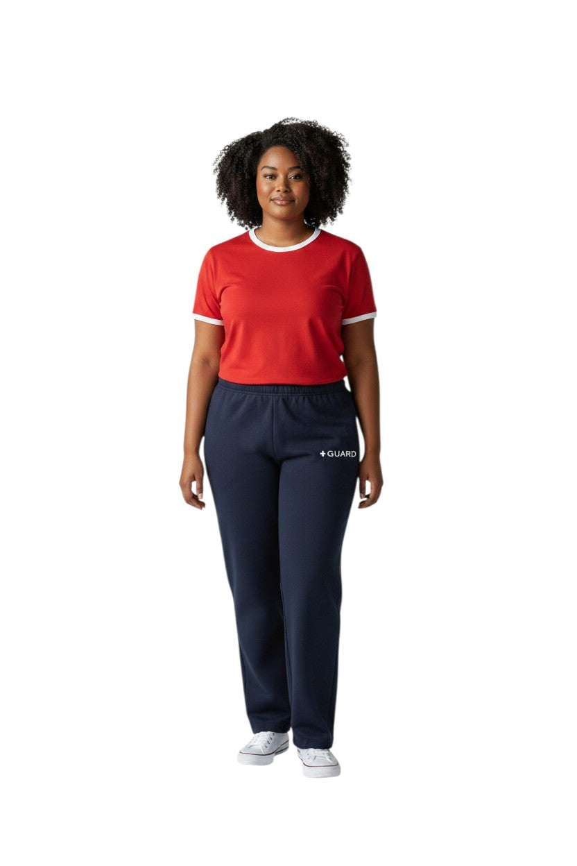 The Lifeguard Store navy blue sweatpants with drawstring and side pockets, featuring a white + GUARD logo.