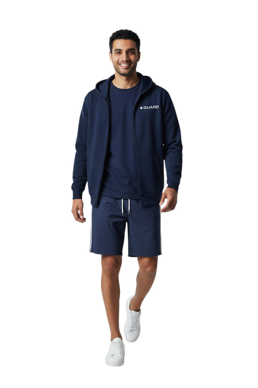 The Lifeguard Store navy blue cotton-polyester blend zip-up hoodie with "GUARD" logo on chest. Features a double-lined hood and front pockets.