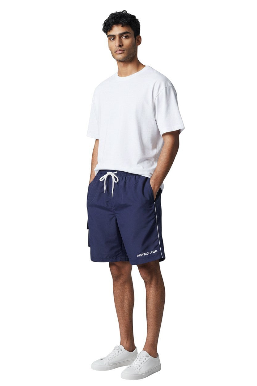 The Lifeguard Store Men's navy blue board shorts with white drawstring and side stripe. 7" inseam.