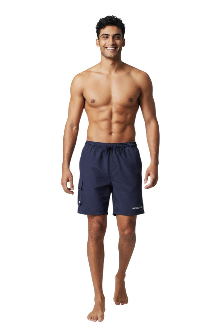 The Lifeguard Store navy blue polyester instructor board shorts with elastic waistband, drawstring, and cargo pocket.