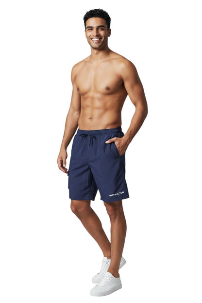 The Lifeguard Store navy blue polyester instructor board shorts with elastic waistband, drawstring, and cargo pocket.