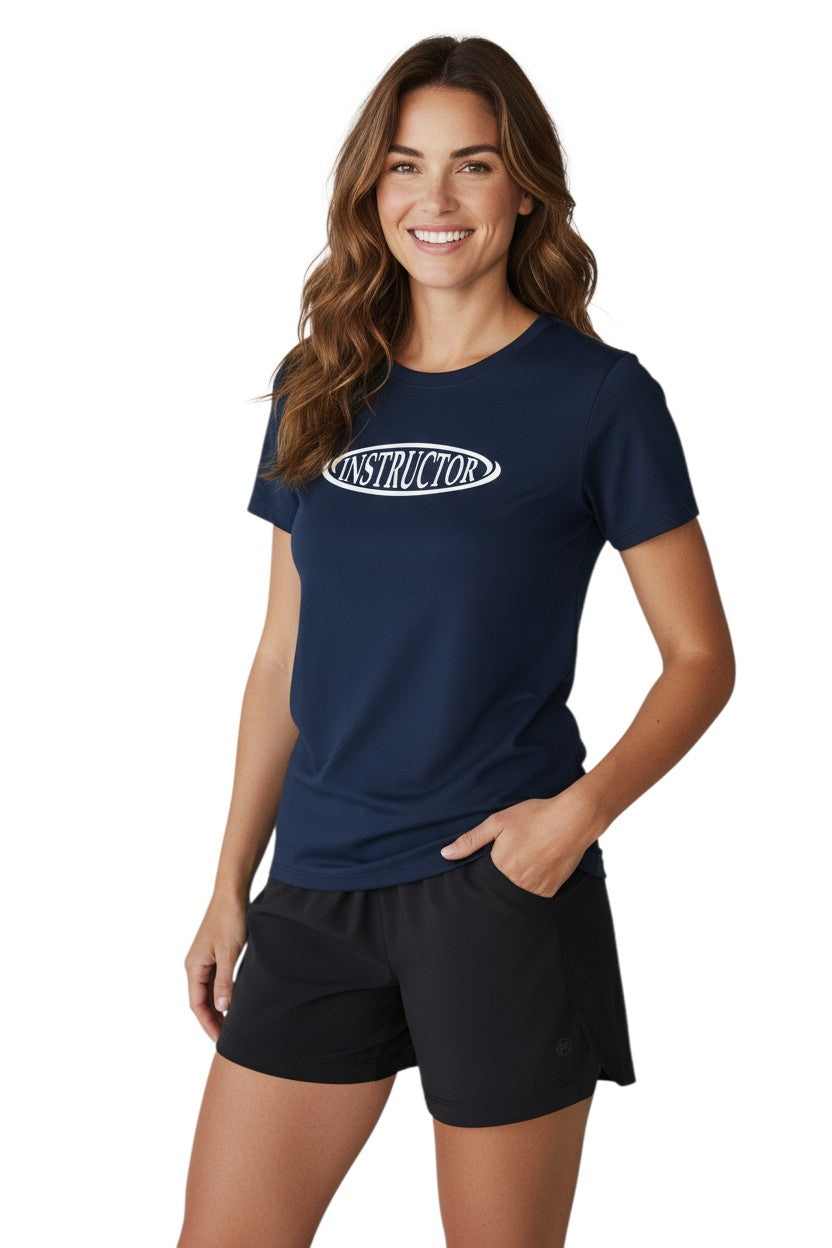 The Lifeguard Store navy blue short sleeve rashguard with white "INSTRUCTOR" text on chest. Made of poly-spandex fabric.