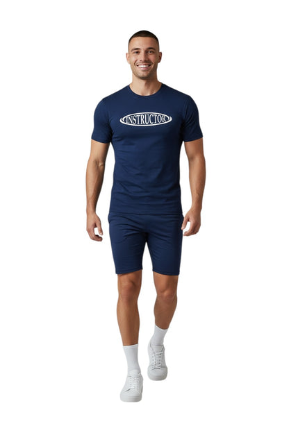 The Lifeguard Store navy blue short sleeve rashguard with white "INSTRUCTOR" text on chest. Made of poly-spandex fabric.