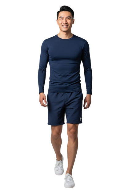 The Lifeguard Store navy blue long sleeve crewneck rashguard made of polyester and spandex with UPF50+ UV protection.