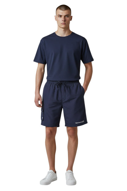 The Lifeguard Store navy blue polyester Manager board shorts with elastic waistband, drawstring, and cargo pocket.