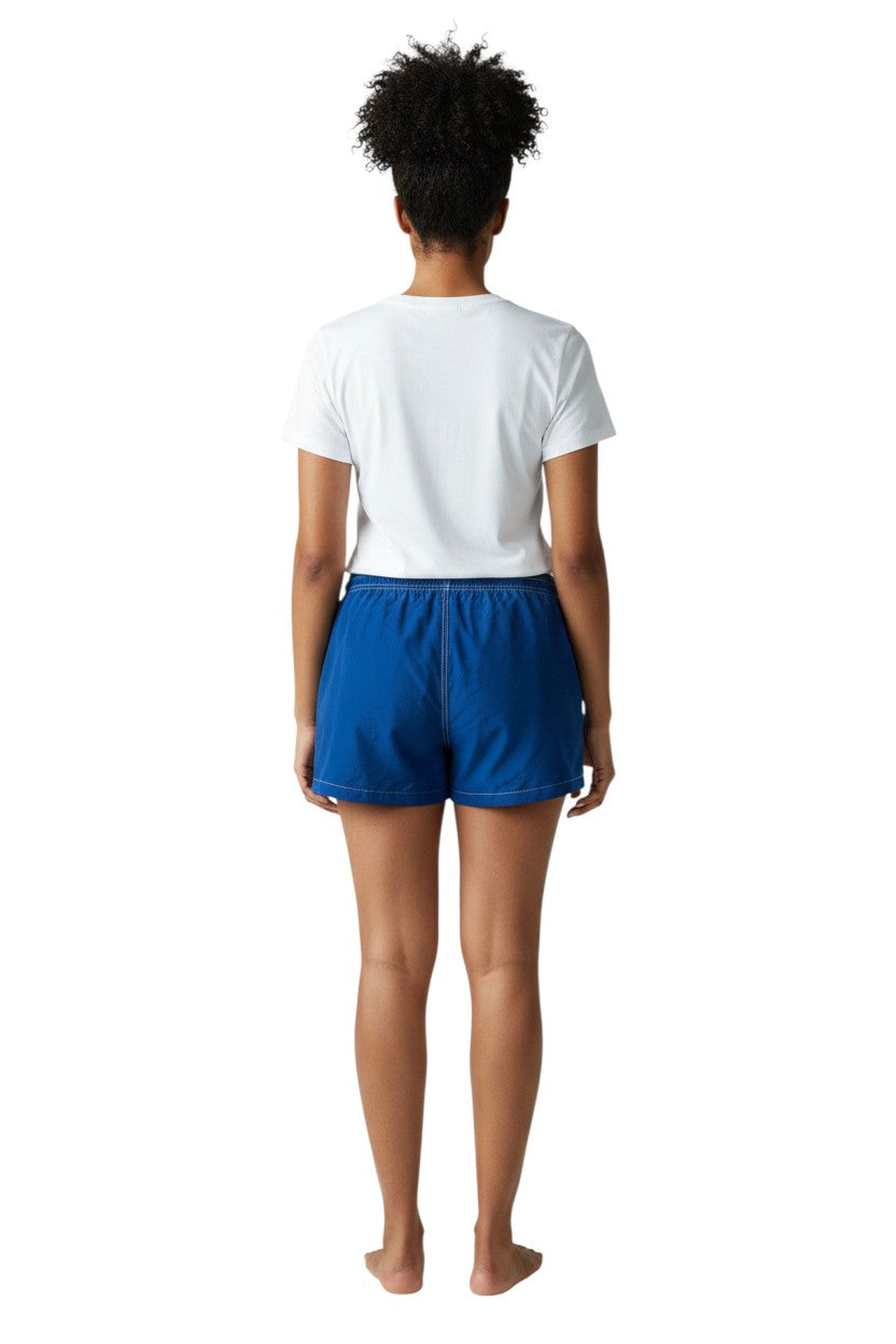 The Lifeguard Store navy blue nylon board shorts with 3" inseam, elastic waistband, drawstring, and side pocket.