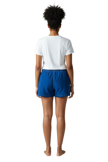 The Lifeguard Store navy blue nylon board shorts with 3" inseam, elastic waistband, drawstring, and side pocket.