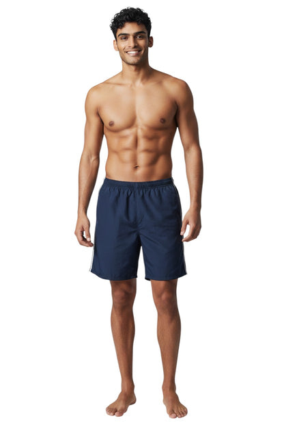 The Lifeguard Store navy blue nylon trunk shorts with white side piping and elastic waistband.