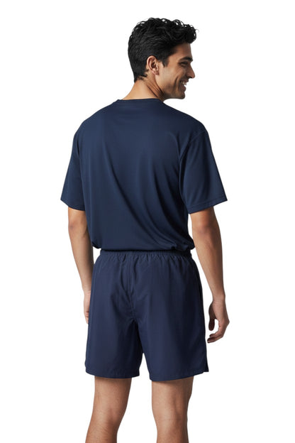 The Lifeguard Store navy blue polyester board shorts with elastic waistband and drawstring. Features 7" inseam.
