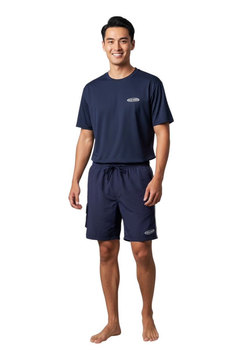 The Lifeguard Store navy blue polyester board shorts with elastic waistband, drawstring, and velcro pocket. Features 7" inseam and UPF 50+ protection.