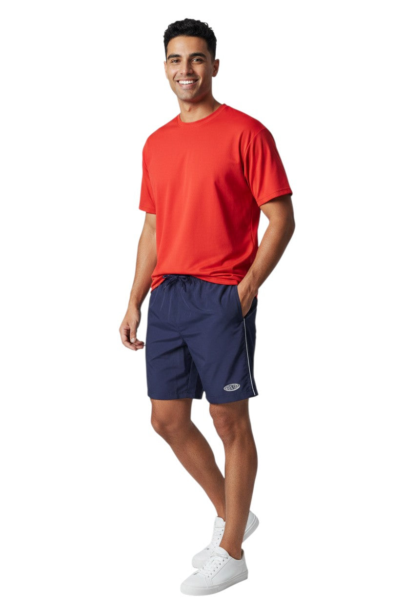 The Lifeguard Store navy blue polyester board shorts with white piping and drawstring waist. Features 7" inseam.