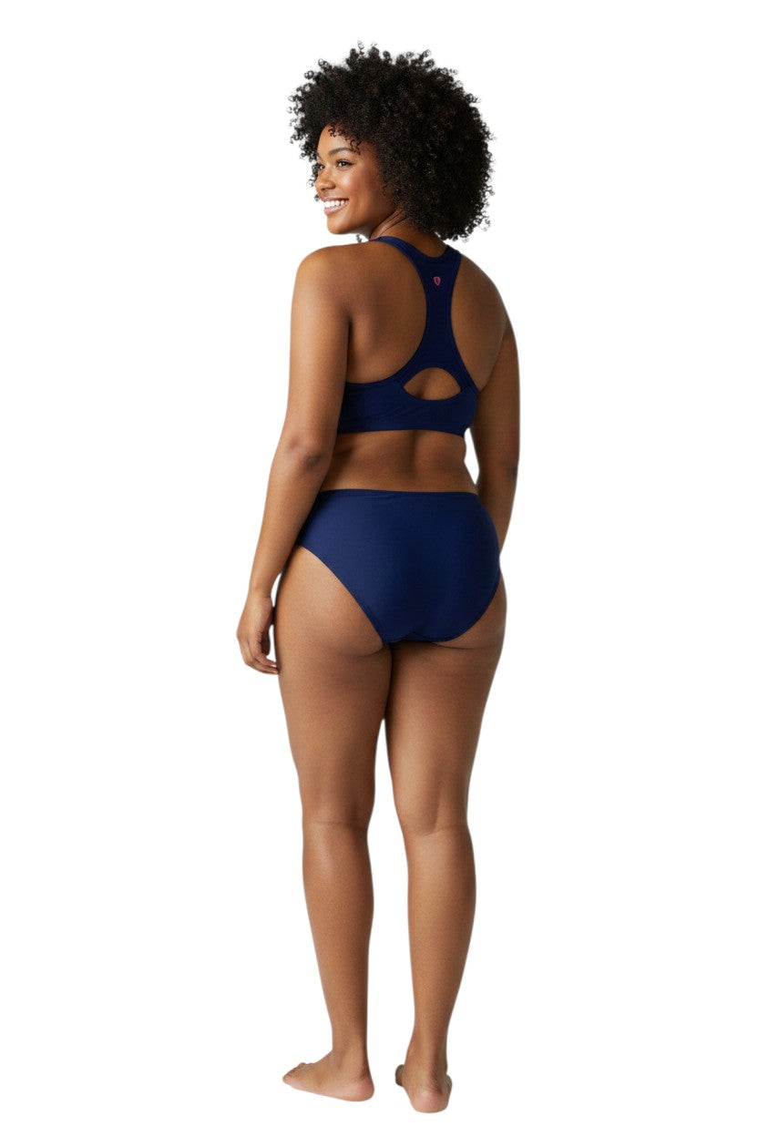 The Lifeguard Store navy blue poly stretch racer back top with pink seahorse logo. UPF50+.