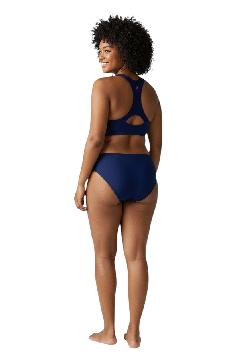 The Lifeguard Store navy blue poly stretch racer back top with pink seahorse logo. UPF50+.
