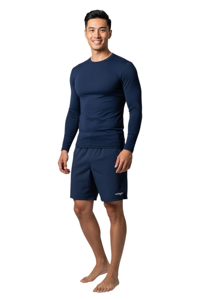 The Lifeguard Store Kiefer Solid Long Sleeve Crewneck Rashguard in navy blue, made of polyester and spandex with UPF50+ UV protection.