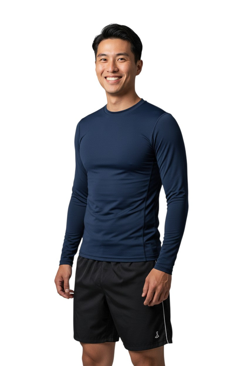 The Lifeguard Store RISE Solid Long Sleeve Crew Neck Rashguard in navy blue, made of polyester and spandex with UPF50+ protection.