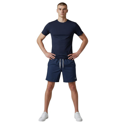 The Lifeguard Store navy blue short sleeve crew neck rashguard made of polyester and spandex with UPF50+ protection.