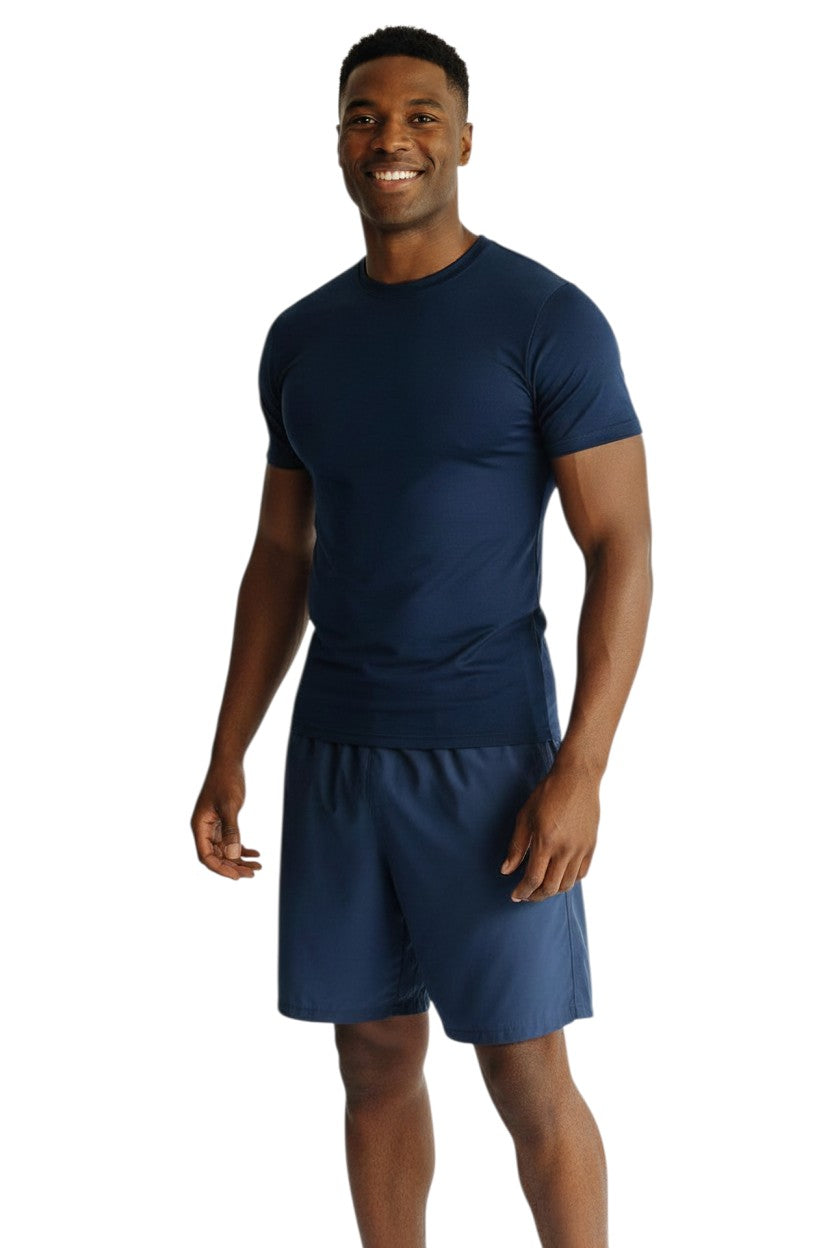 The Lifeguard Store navy blue short sleeve crewneck rashguard made of poly-stretch fabric with UPF50+ protection.