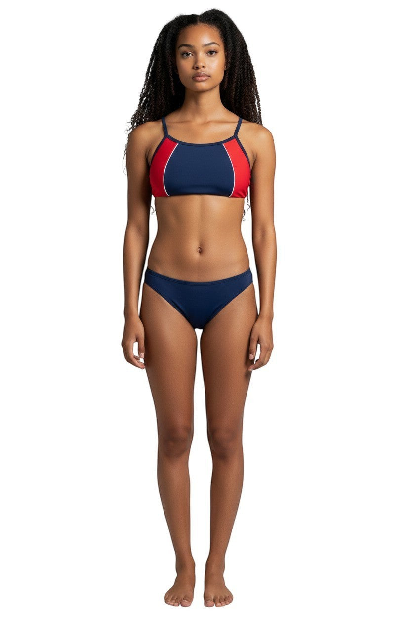 Model wearing The Lifeguard Store navy and red athletic two-piece bikini with flat-locked seams for training.