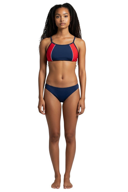 Model wearing The Lifeguard Store navy and red athletic two-piece bikini with flat-locked seams for training.