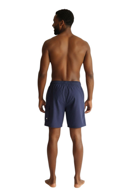 The Lifeguard Store navy blue polyester staff board shorts with elastic waistband, drawstring, and cargo pocket.