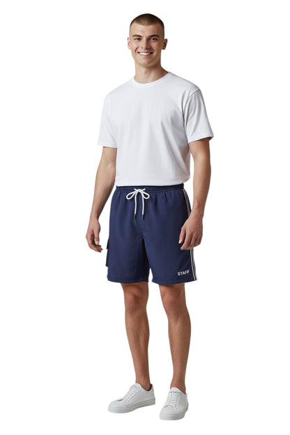 The Lifeguard Store navy blue polyester staff board shorts with liner, elastic waistband, drawstring, and cargo pocket.